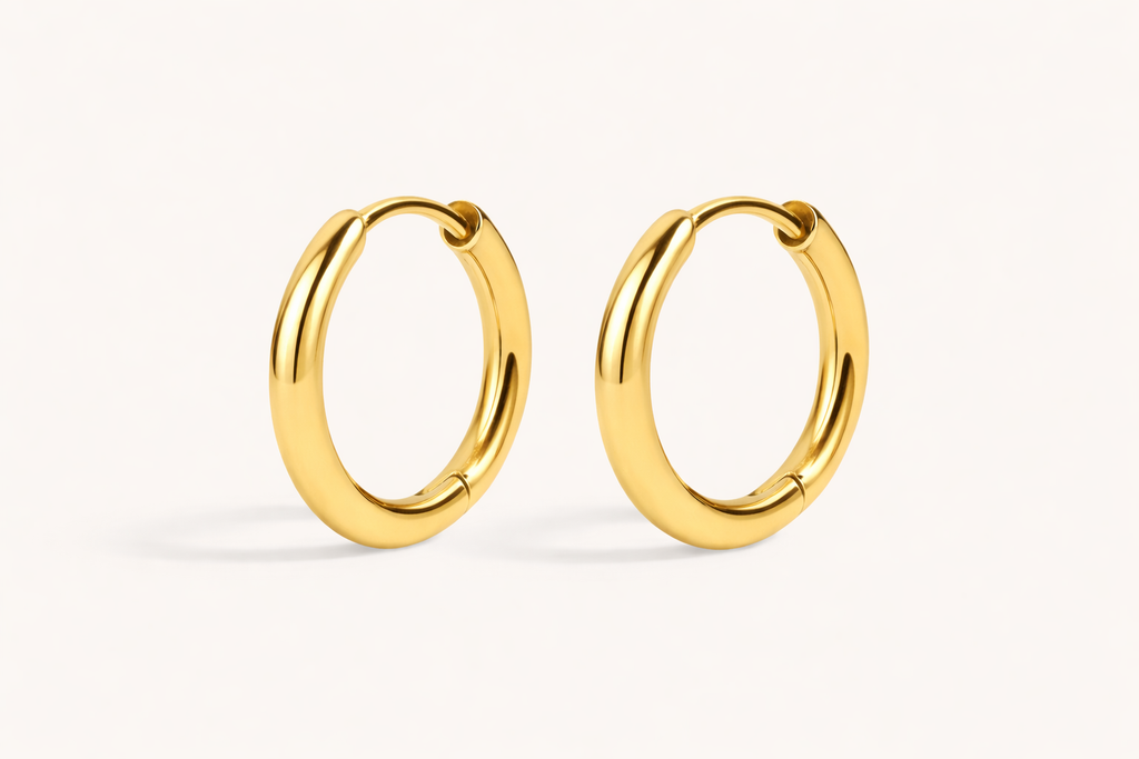 Gold hoop earrings on a white background