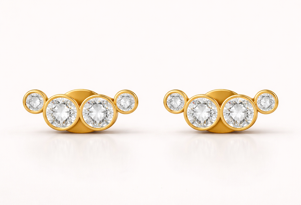 Pair of gold earrings with cz diamonds on a white background