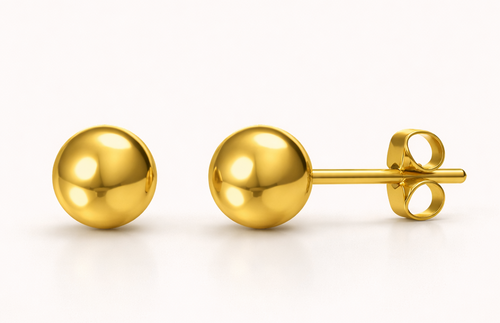 Pair of gold ball earrings on a white background