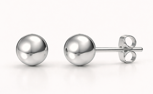 Pair of silver ball earrings on a white background