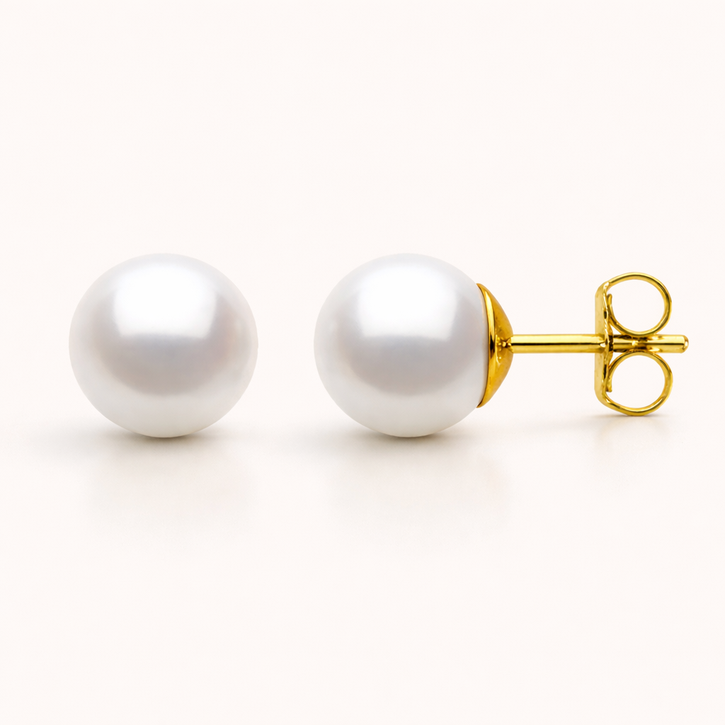 Pearl earrings with gold posts on a white background